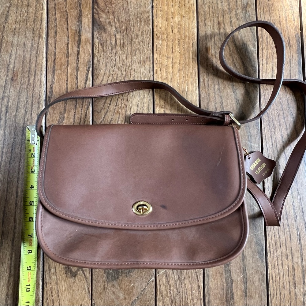 Brown crossbody bag with leather interior & zippered pockets